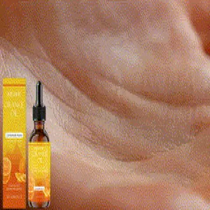 Vista macro del aceite esencial de naranja EELHOE sobre fondo de textura de piel