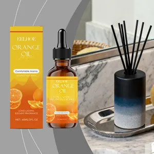 Aceite esencial de naranja EELHOE premium de 60ml en una encimera de mármol de lujo