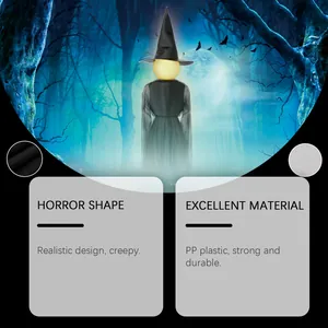 Halloween witch decoration with glowing head and spooky forest background detail