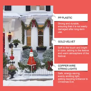 Detail view of the Santa Claus garden stake with festive light and velvet texture