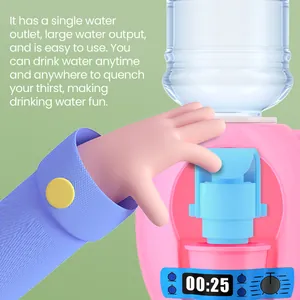 Detailed view of pink mini water dispenser toy showing water outlet operation