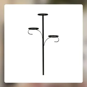 Close-up of black triple tiered tree topper candle holder with elegant curved iron arms