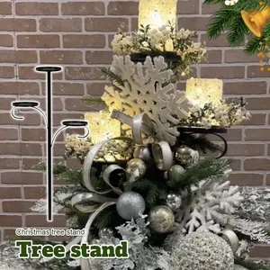 Close-up of black triple tree topper candle holder in a decorated Christmas tree.