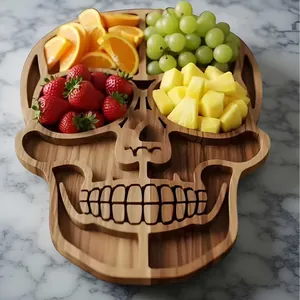 Detailed skull shaped wooden Halloween charcuterie board with fresh fruit arrangement