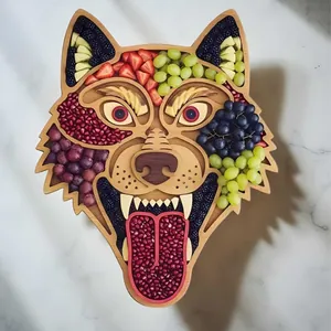 Detailed view of a wolf-shaped wooden charcuterie board filled with colorful fresh fruits