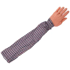 Detail view of a Halloween prank prosthetic hand with a red and blue plaid shirt sleeve
