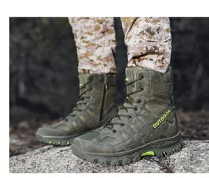 Side view of olive green high-top tactical combat boots with bright yellow outdoor accents
