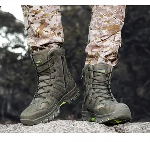 Close-up action shot of men's high-top outdoor tactical combat boots on a rocky terrain