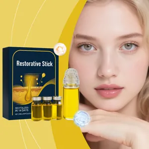 Detailed view of the restorative facial serum set featuring a roll-on bottle and ampoules