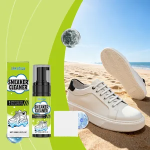 Detail of Jakehoe foam sneaker cleaner set with cleaning cloth and white shoes on beach