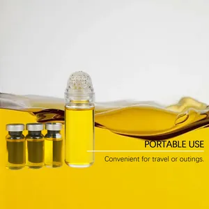 Close-up of portable facial essence oil vials on a dynamic yellow liquid splash background
