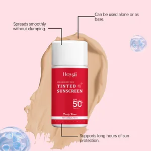 Detail showing Hoygi Strawberry Tinted Sunscreen SPF 50+ with smooth beige cream texture