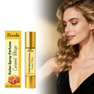 Detailansicht von Roxelis Caramel Roller-Spray Parfümflasche und gelber Verpackung