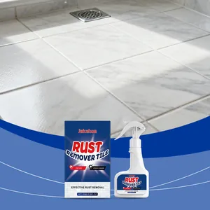 Détail du flacon pulvérisateur et boîte JAKEHOE sur carrelage en marbre