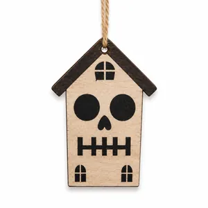Detail of Halloween wooden house ornament with skull face and jute hanging rope
