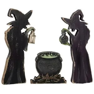 Set of three rustic wooden Halloween witch silhouettes and cauldron tabletop decorations.