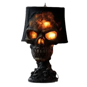 Gothic lava stone skull lamp with glowing eyes for Halloween home decor.