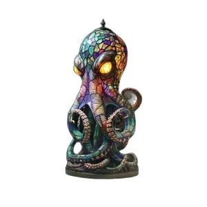 Lampada a forma di polpo in resina stile vetro colorato con occhi luminosi su bianco