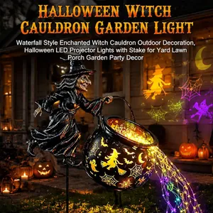 Close-up of Halloween witch cauldron garden light with LED waterfall and projector effects