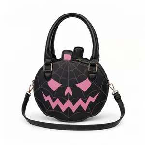 Detailed view of black Halloween pumpkin handbag with pink spiderweb Jack-o'-lantern face