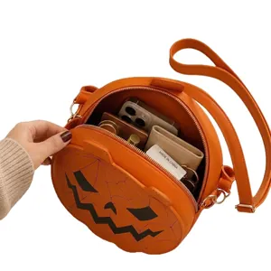 Halloween pumpkin-shaped orange leather handbag featuring a Jack-o'-lantern face design