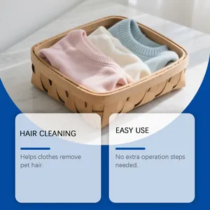 Close-up of clean sweaters in a bamboo basket after using pet hair laundry cleaning balls