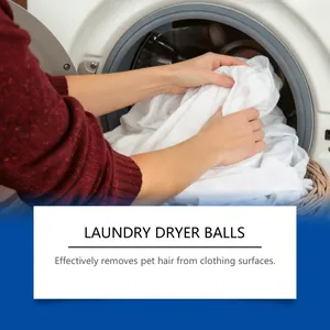 User removing white clothes and pet hair removal ball from a front-load washer.