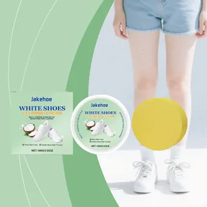 Détail du kit de crème nettoyante Jakehoe avec boîte, pot et éponge jaune pour chaussures
