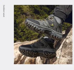 Detailed view of durable men's hiking shoes with non-slip soles in nature