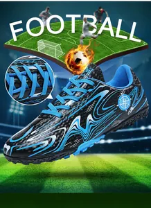 Close-up detail of the durable blue laces on professional black and blue soccer shoes
