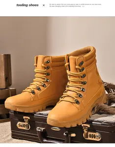 Detail view of yellow high-top tactical combat boots for outdoor hiking on suitcase