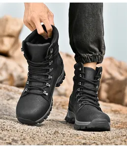 Men's black high-top tactical combat boots shown on rugged outdoor rocky terrain