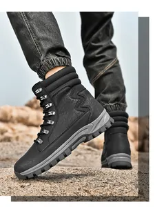 Black high-top tactical hiking boots with non-slip sole shown on rocky terrain