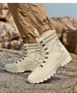Men's beige high-top tactical combat boots shown worn on rocky outdoor terrain view