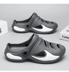 Grey hollow-out beach clogs for men with white wave details and two-way wear strap