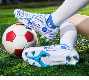 Detailed view of professional football cleats showing blue studs and wave pattern