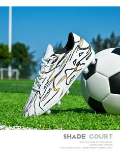 Professional low-top soccer shoes on artificial turf field with soccer ball