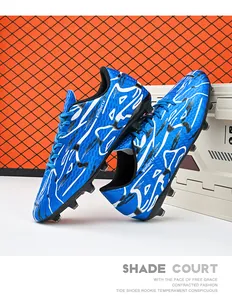 Detailed side view of blue soccer cleats with white ripple patterns for firm ground