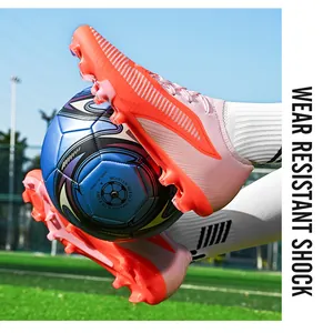 Detailed action shot of pink seamless flyknit soccer cleats for artificial grass use
