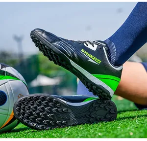 Detailed view of breathable turf soccer shoes with durable green studs