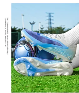 Side view of blue fly-knit soccer cleats on grass with a professional soccer ball