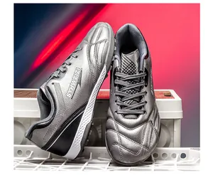 Metallic silver soccer cleats with breathable upper and turf traction outsoles