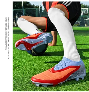 Detail shot of fly-knit soccer cleats showing traction on artificial turf field.