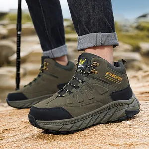 Professional men's high-top outdoor hiking boots in olive green on a rugged rocky terrain