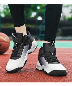 Close-up view of men's high-top basketball shoes with gradient white to black design