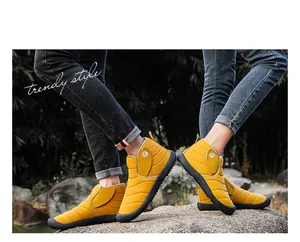Detailed macro view of yellow winter snow boots with quilted design and warm lining