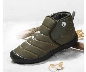 Detail of army green waterproof snow boots with warm fleece lining for winter outdoors