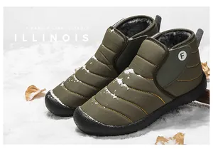 Insulated olive green snow boots with warm fur lining in a winter outdoor setting