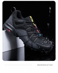 Detailed shot of black waterproof hiking shoe with splash effect and durable texture