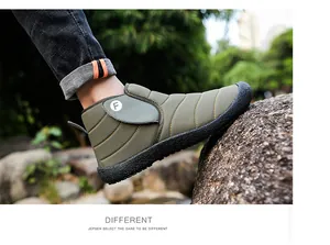 Detail of olive green winter snow boot with fleece lining for outdoor activities.